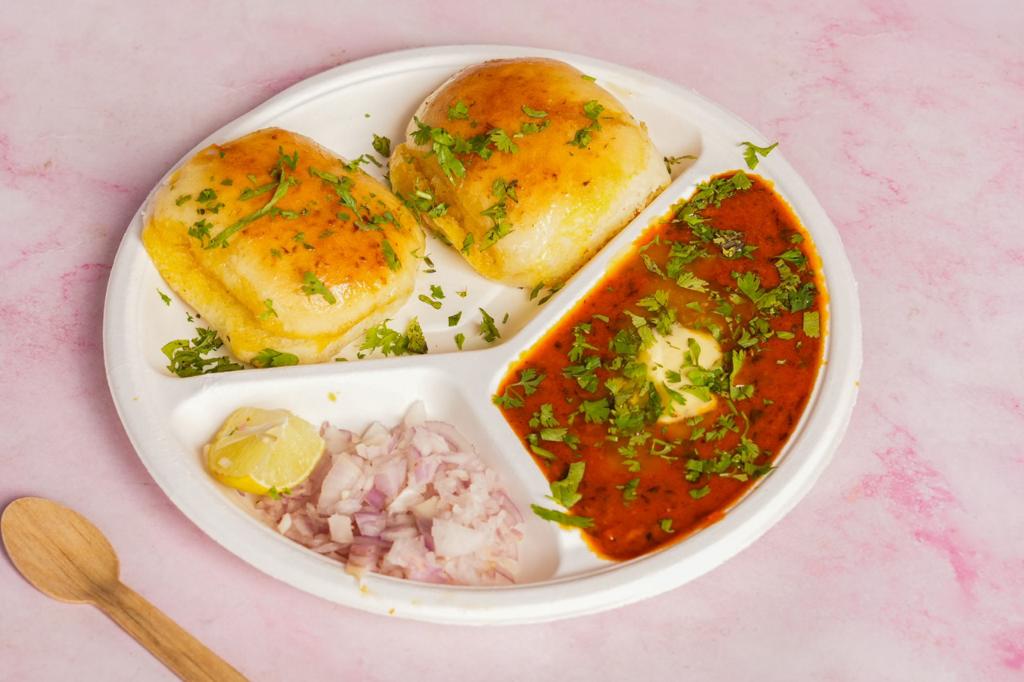 Relish the Magic of Mumbai Pav Bhaji: A Taste of Home Delivered to You