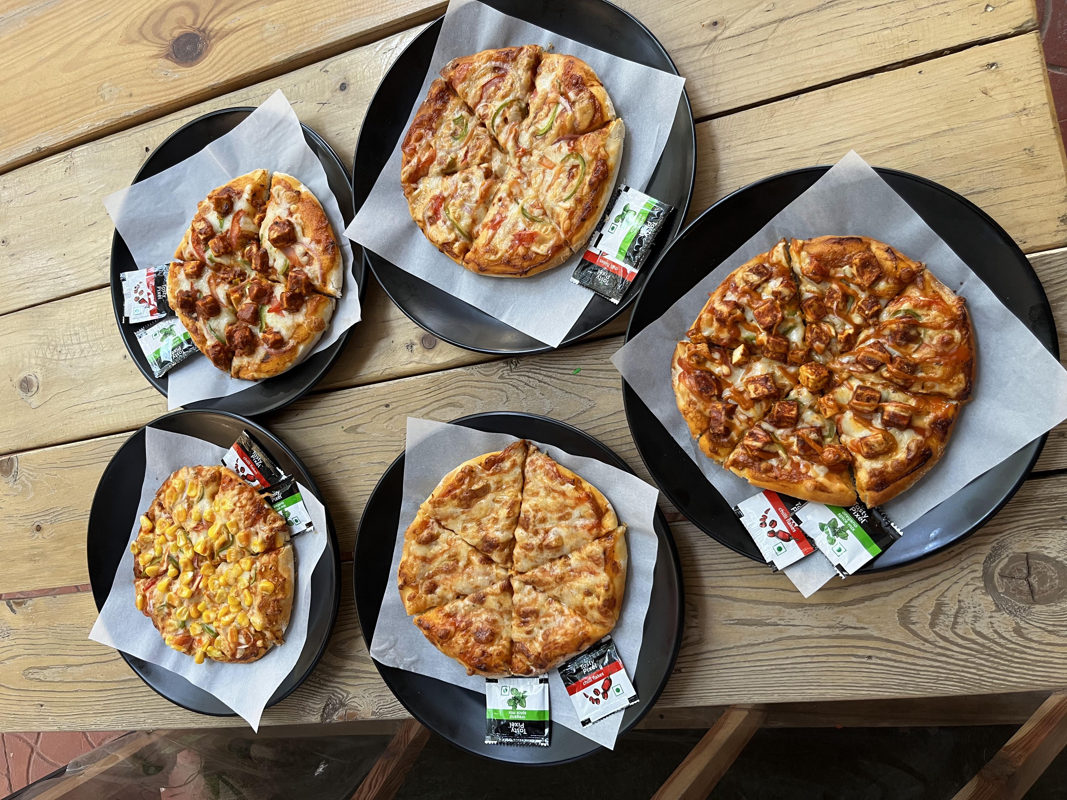 Satisfy Every Craving with Café Arosha’s Assorted Pizza Selection