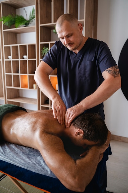 Male to male body massage-https://i-media.vyaparify.com/vcards/products/23621/high-angle-man-getting-massage_23-2150649770-(2).jpg Image