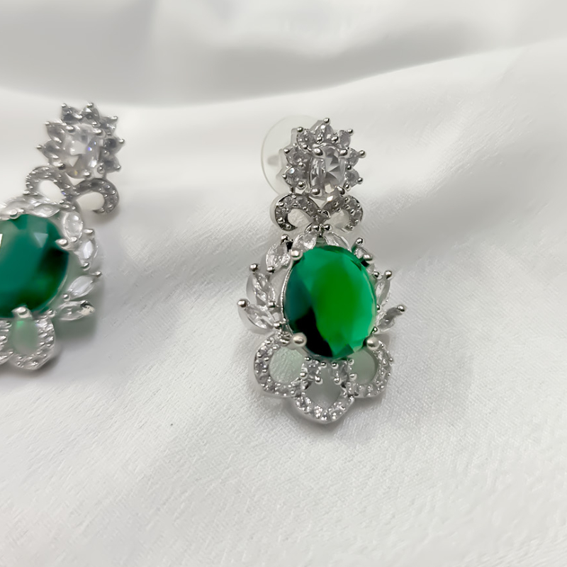 Emerald green stone imitation earrings with silver-https://i-media.vyaparify.com/vcards/products/303692/product_1758118415_68cac20f61570.jpeg Image