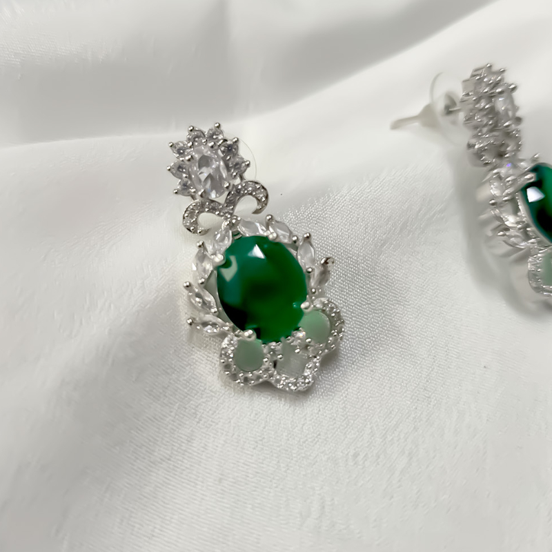 Emerald green stone imitation earrings with silver-https://i-media.vyaparify.com/vcards/products/303693/product_1758118415_68cac20f881db.jpeg Image