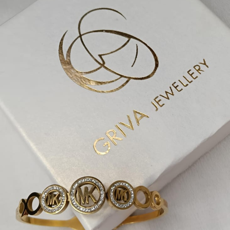 Golden MK Elegance Bracelet-https://i-media.vyaparify.com/vcards/products/305163/product_1761734515_6901ef73bfc99.jpeg Image
