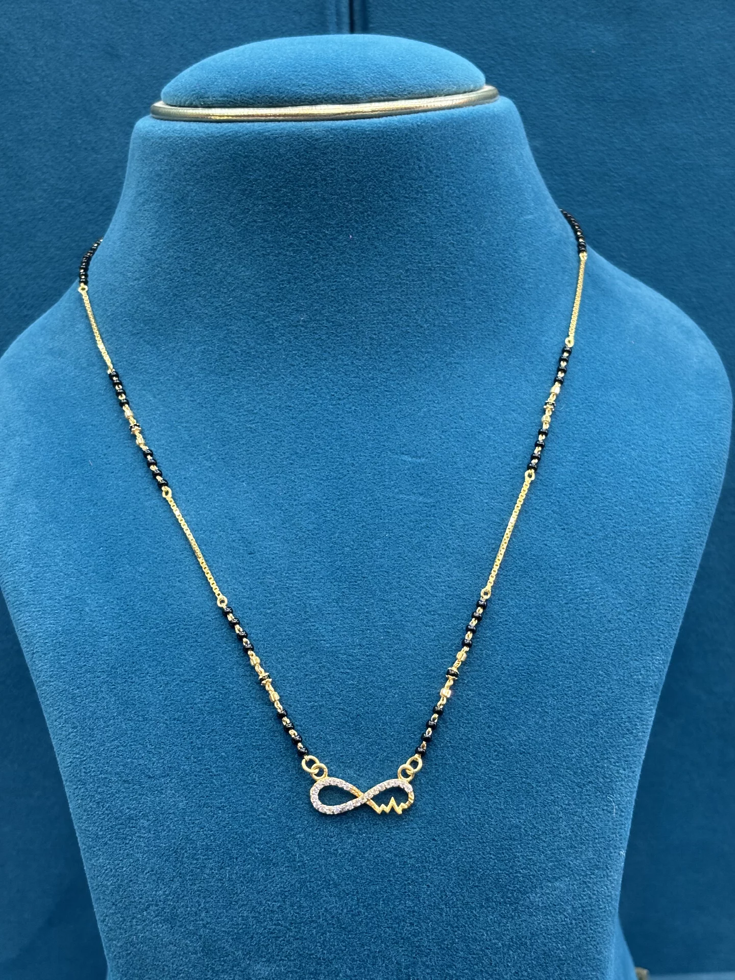 Infinity Pendant Black Bead Amrutha Jewellers 23-11-7, Nageswara Rao Pantulu Rd, Satyaranayana Puram, Vijayawada, Andhra Pradesh 520011, India