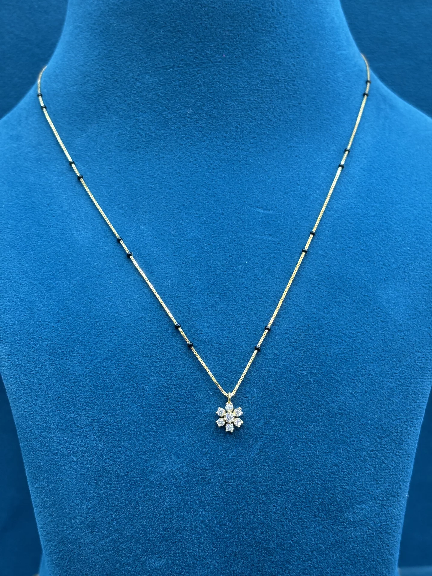 Flower Pendant Black Beads Amrutha Jewellers 23-11-7, Nageswara Rao Pantulu Rd, Satyaranayana Puram, Vijayawada, Andhra Pradesh 520011, India