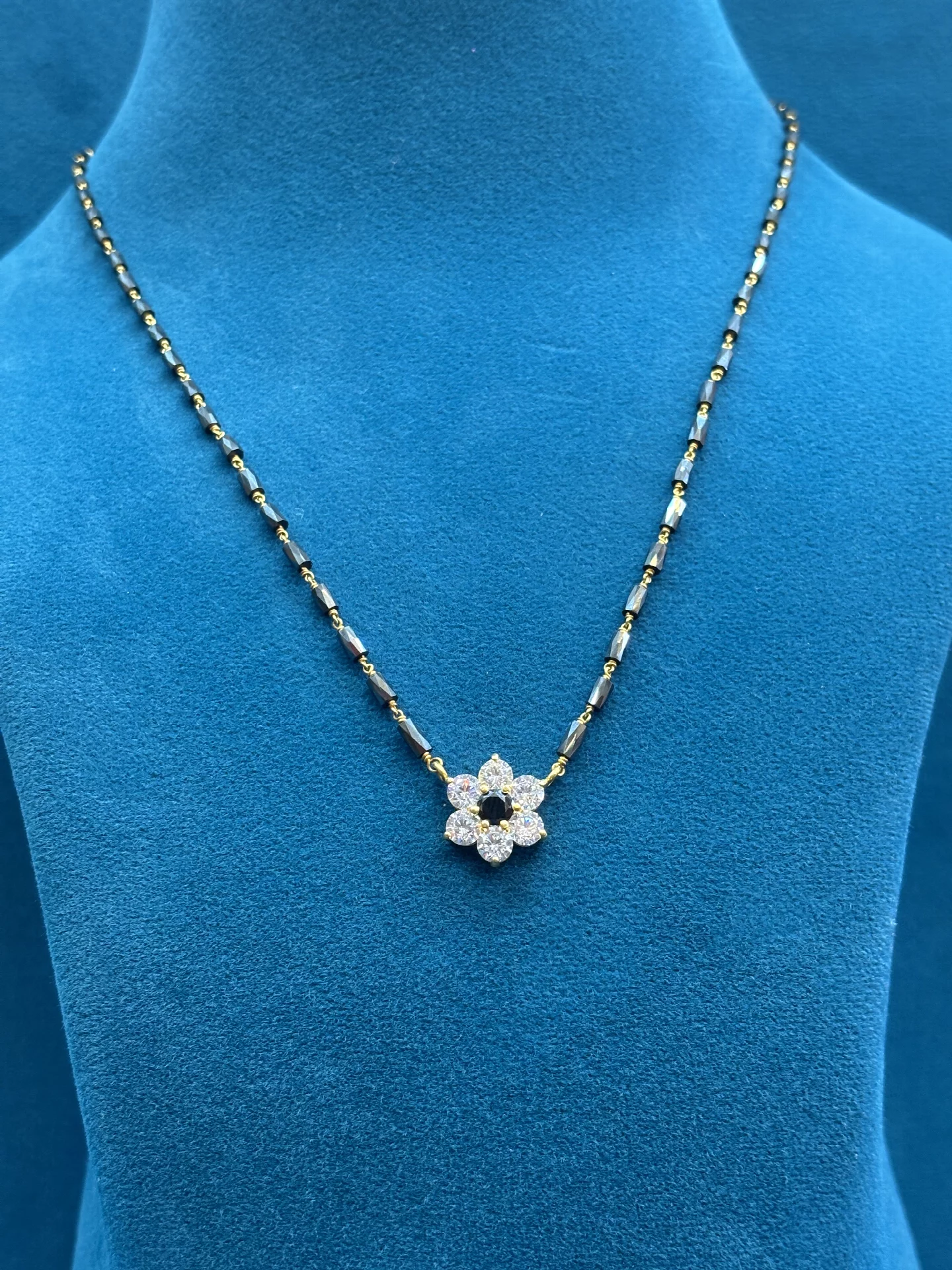 Flower Pendant Black Beads Amrutha Jewellers 23-11-7, Nageswara Rao Pantulu Rd, Satyaranayana Puram, Vijayawada, Andhra Pradesh 520011, India