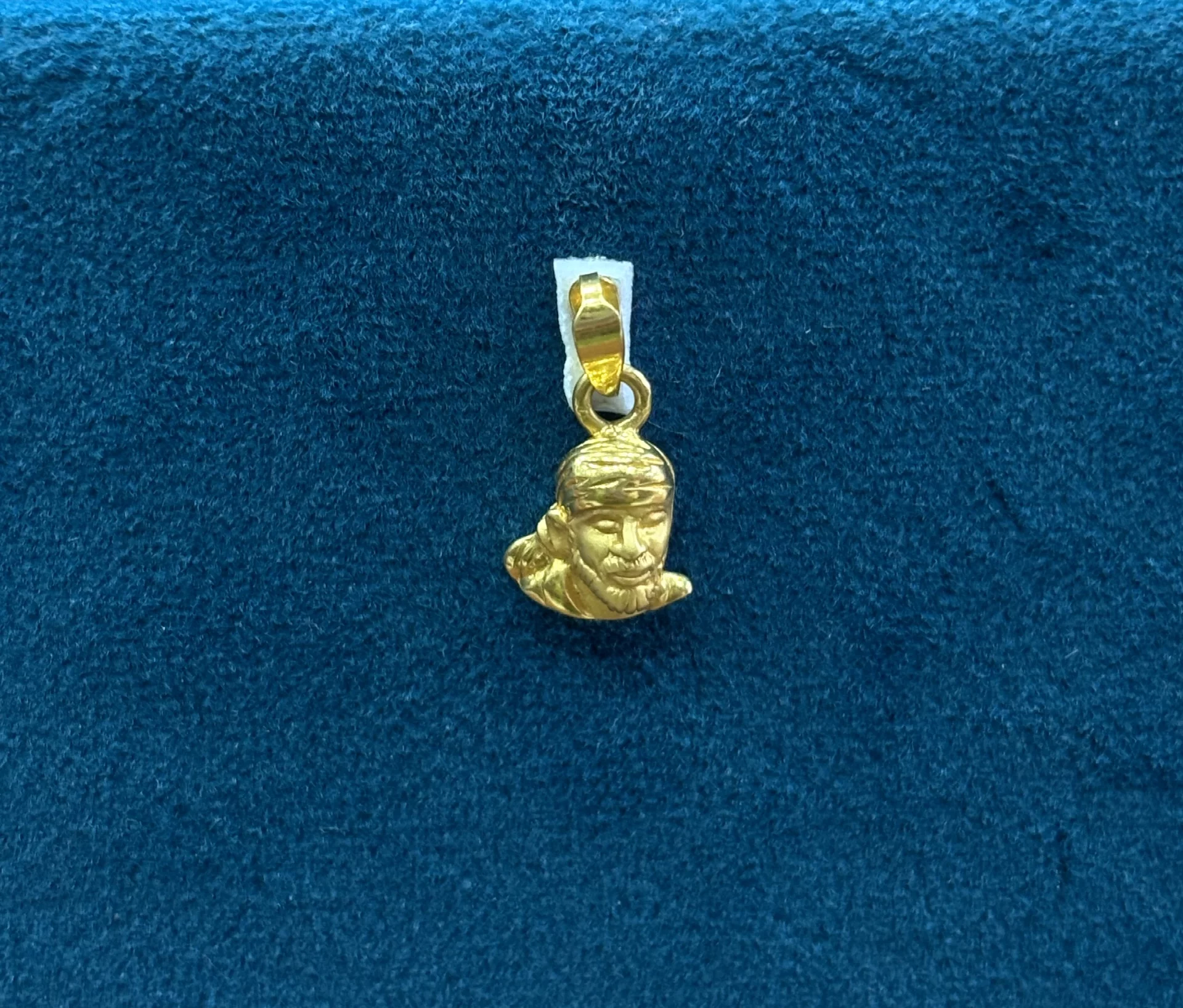 Gold Casting Sai Baba Locket Amrutha Jewellers 23-11-7, Nageswara Rao Pantulu Rd, Satyaranayana Puram, Vijayawada, Andhra Pradesh 520011, India
