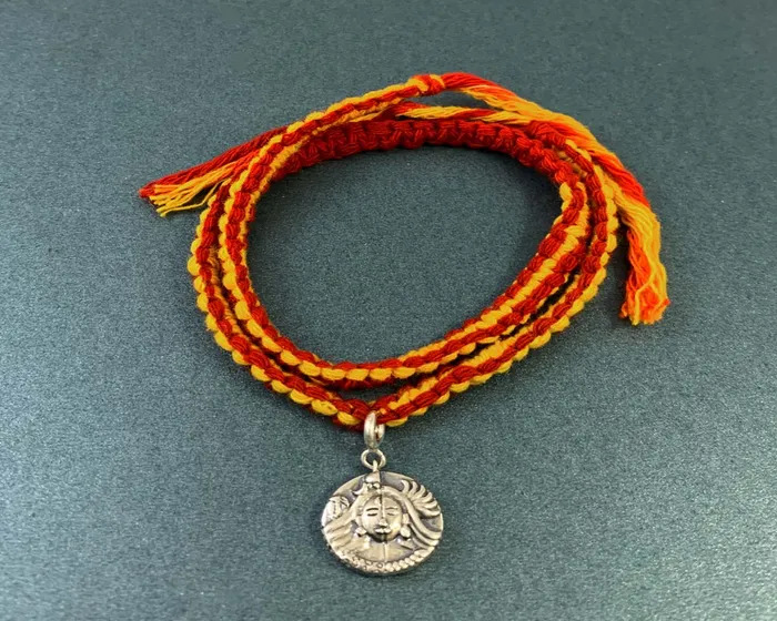 Men's Moli-https://i-media.vyaparify.com/vcards/products/6645/shiva-parvati-aashirwaad-coin-charm-on-double-wrap-moli-rakhi.front.july-2021.jpg Image