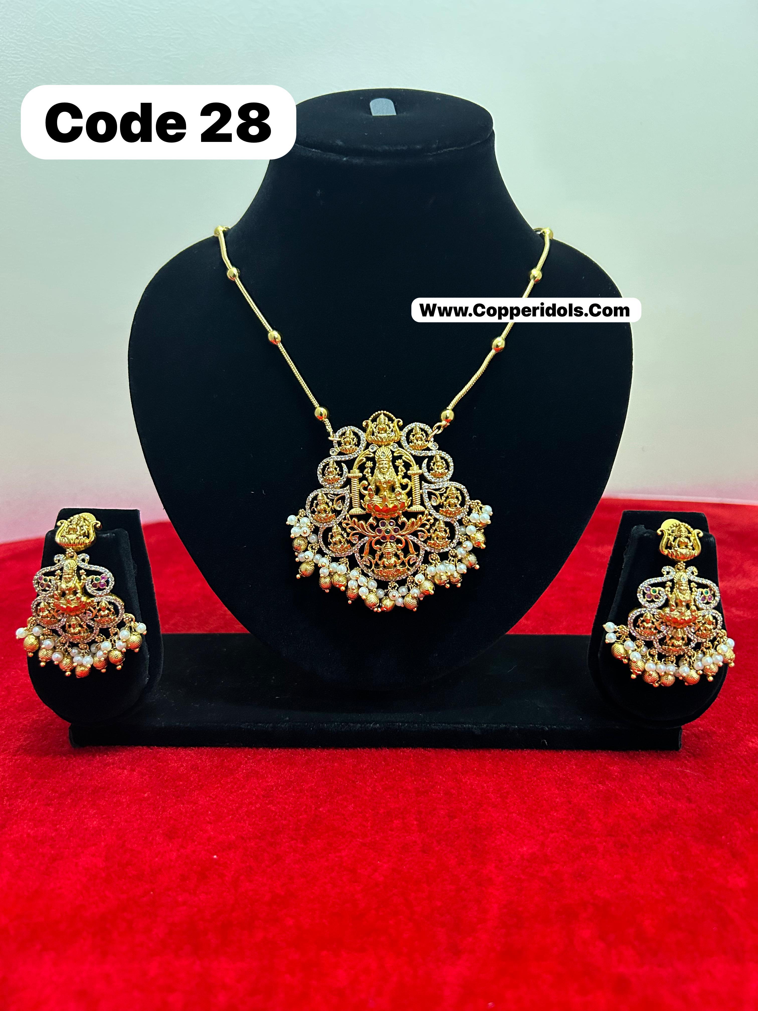 Panchaloha gem studded pendant necklace with earrrings-https://i-media.vyaparify.com/vcards/products/69894/39700414-4bb9-40bc-b8db-6ed0dba3d254.jpg Image