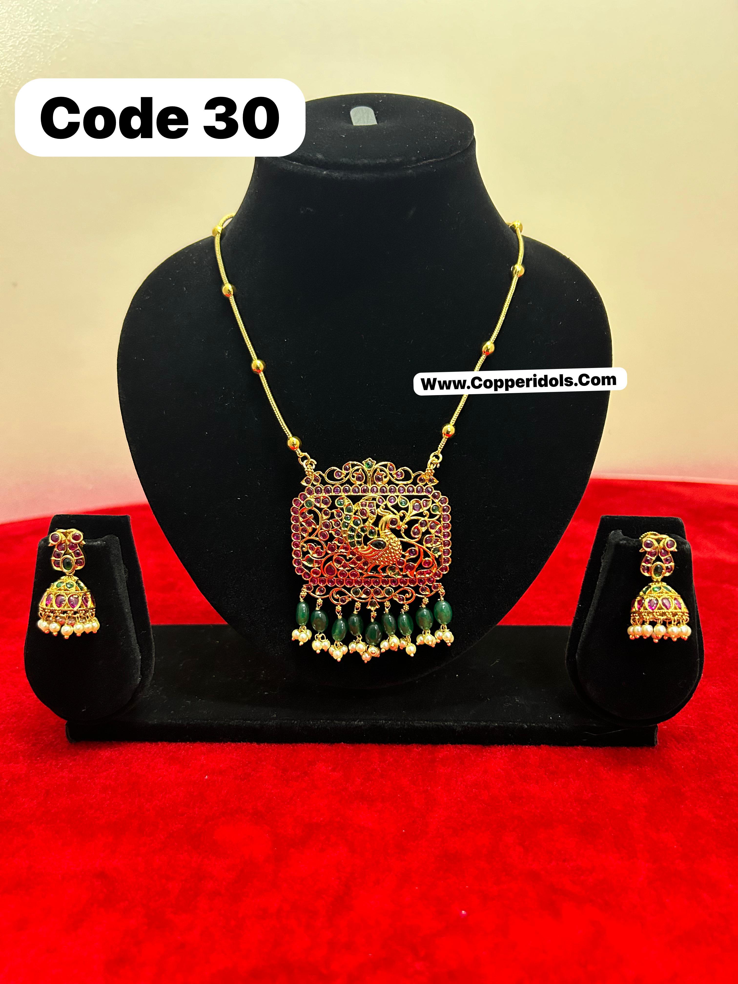 Panchaloha gem studded pendant necklace with earrrings-https://i-media.vyaparify.com/vcards/products/69895/8851e397-4f2c-4b86-a7c5-fbf103f0ba16.jpg Image