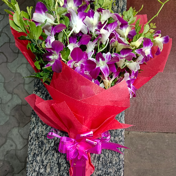 Orchids in red paper wrapping-https://i-media.vyaparify.com/vcards/products/70036/product_1727934471.png Image