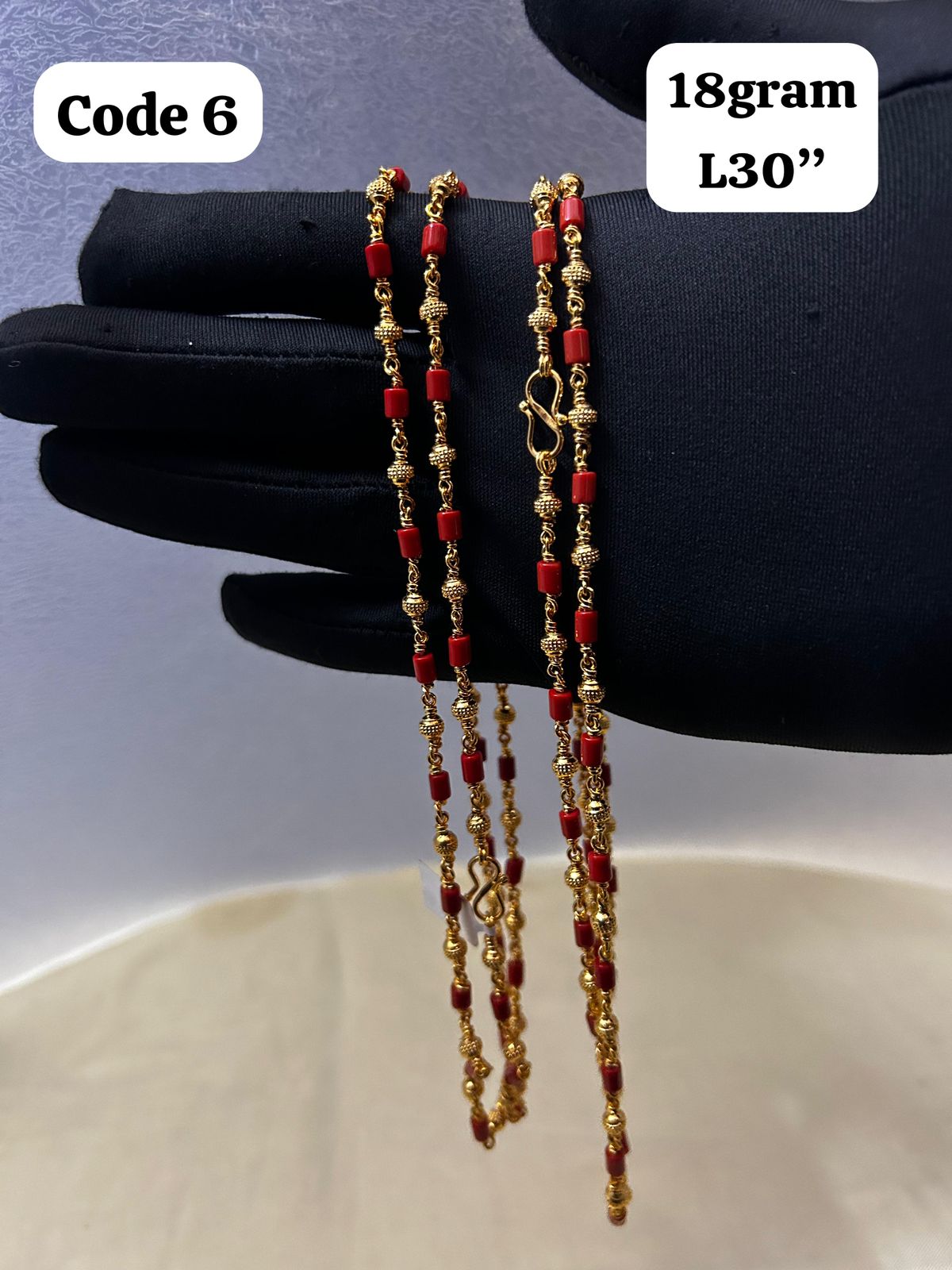 Panchaloha made gold polished gold mala with red beads-https://i-media.vyaparify.com/vcards/products/70096/7cb4bcb4-ba80-4ff7-b4af-5a63116f2906.jpg Image