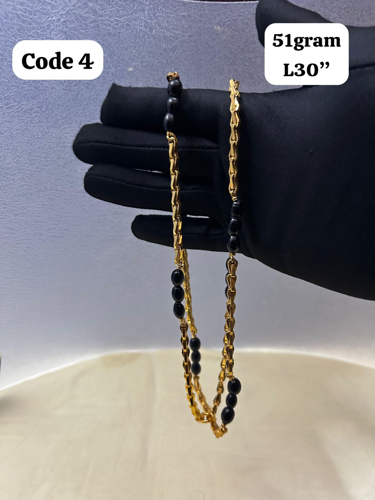 Panchaloha made gold polished chain with black beads-https://i-media.vyaparify.com/vcards/products/70099/3cfd56f9-35d9-459d-ad53-5d7622a04cda.jpg Image