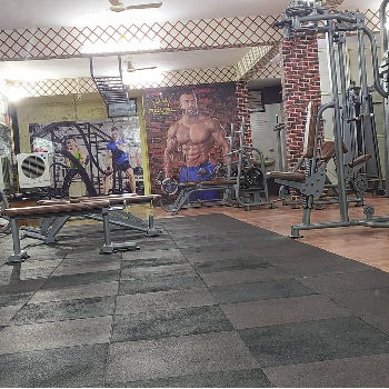 Spacious and ventilated gym area | Royal Fitness Gym | Royal Fitness Opposite Lucky Bakery. Left Side Of Pimpri Kalewadi Bridge. Near BT Memorial School, Main Road Kalewadi.